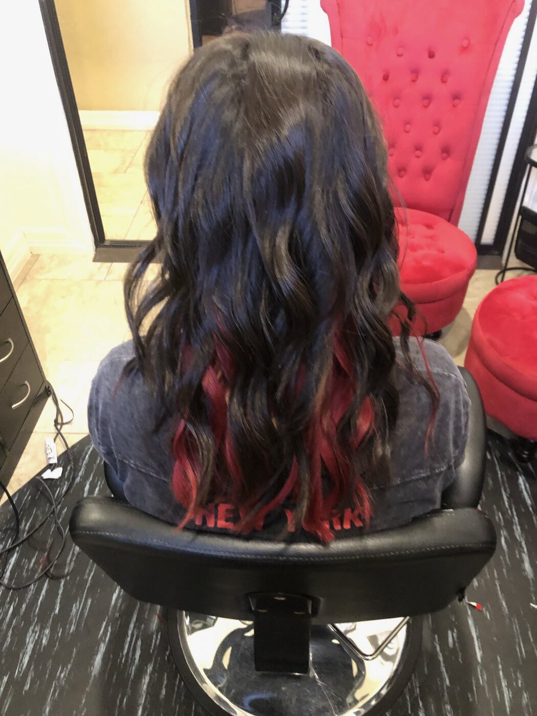 Black hair with red peekaboo highlights
